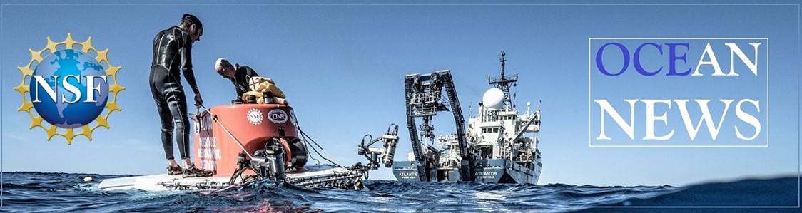 Image of the submersible Alvin at sea with the research vessel Atlantis in the background